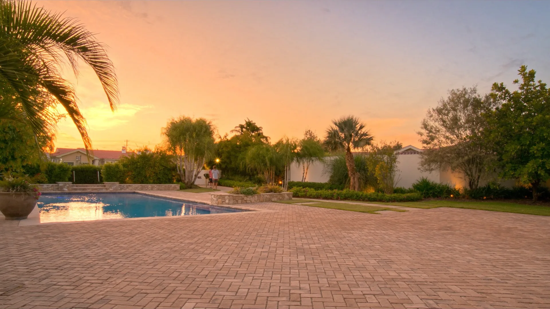 Paver patio and pool at golden hour, Tampa Bay